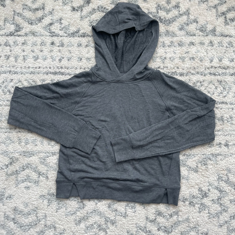 All in motion, hooded crop top with thumb holes, size xs in new condition.